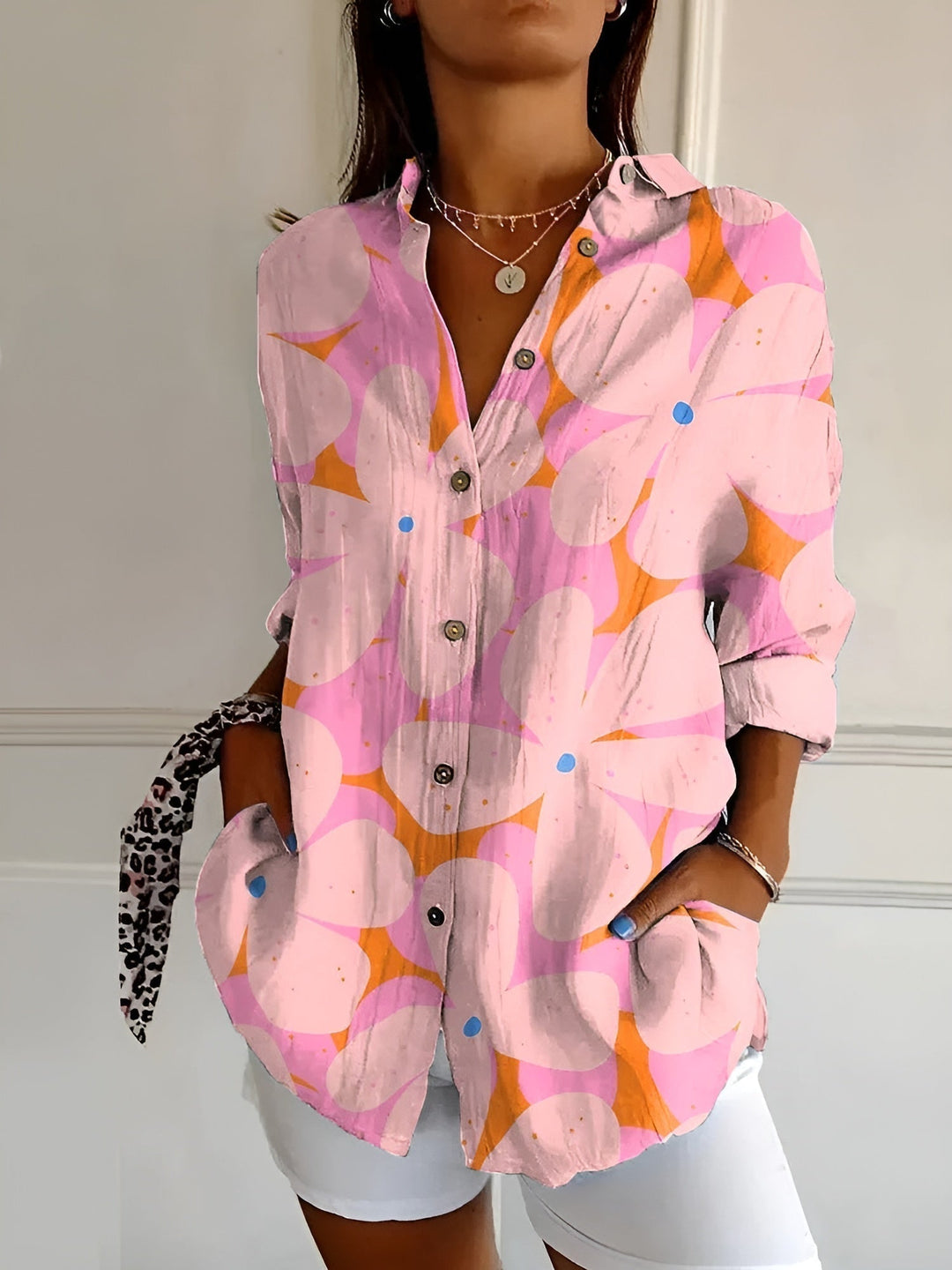 Workwear women's blouse: Abstract print long sleeve top with an elegant split neck design.