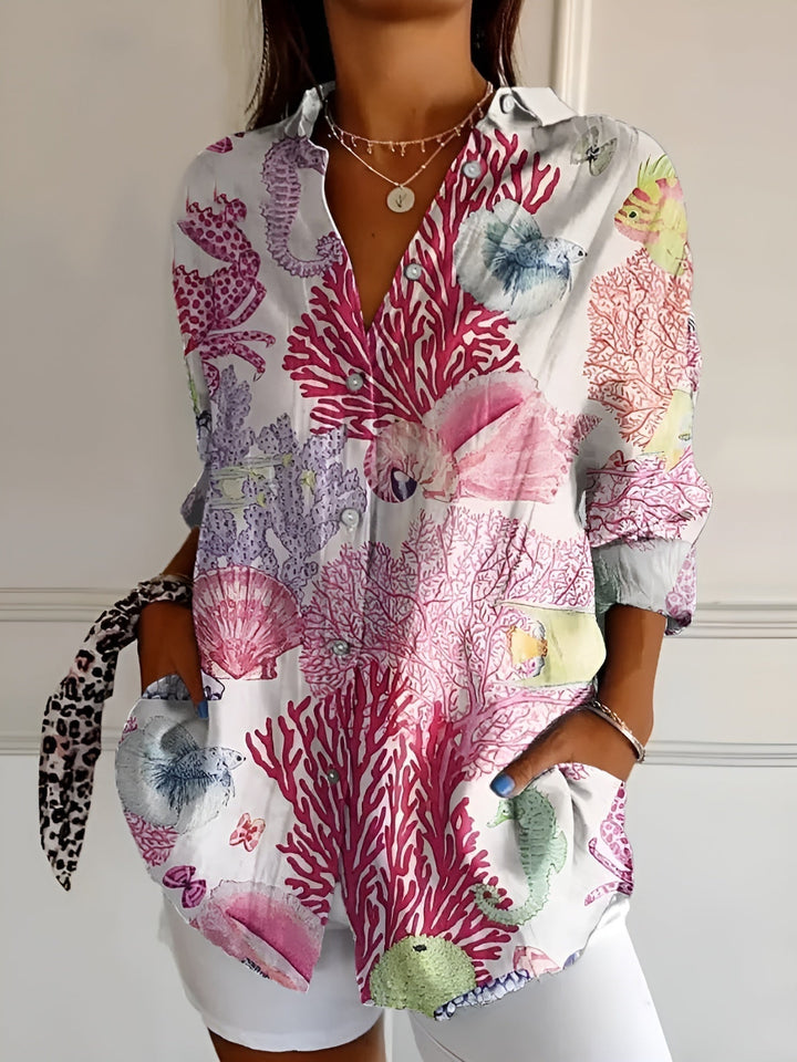 Everyday women's blouse, featuring a unique abstract print and a stylish split neck.