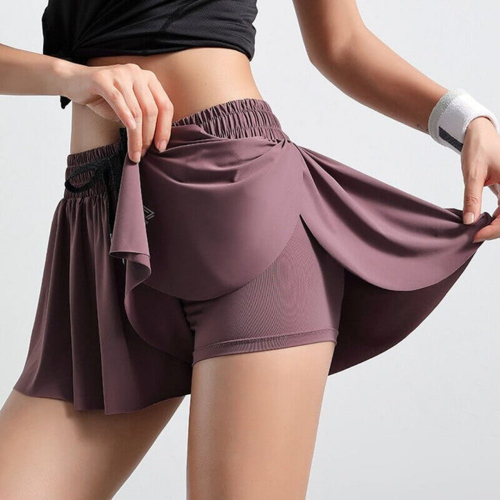 Golf skort with comfort shorts, drawstring waist for women's active lifestyle and style.