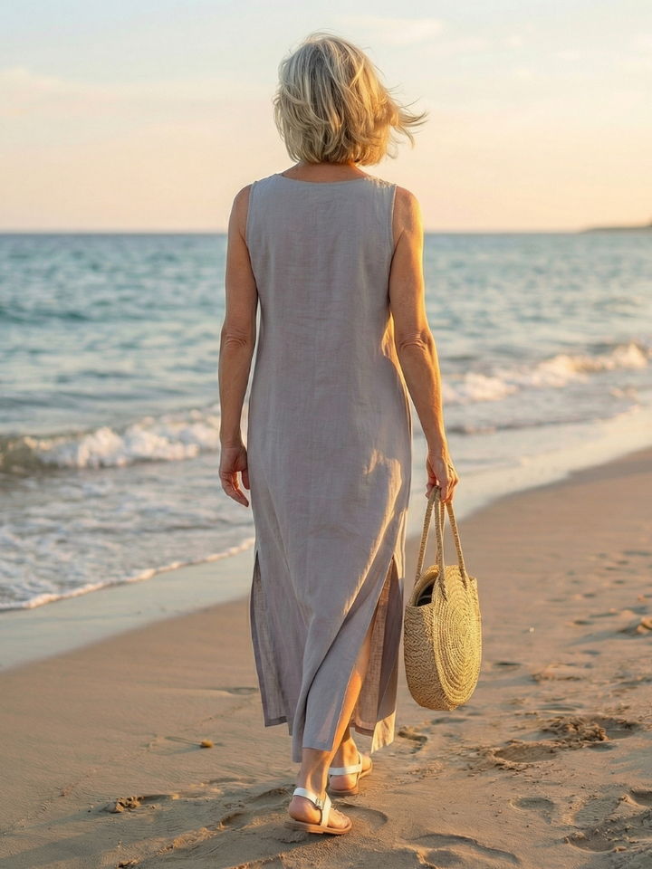 Casual sky blue women's midi dress, sleeveless airy flow style, comfortable for summer travel.