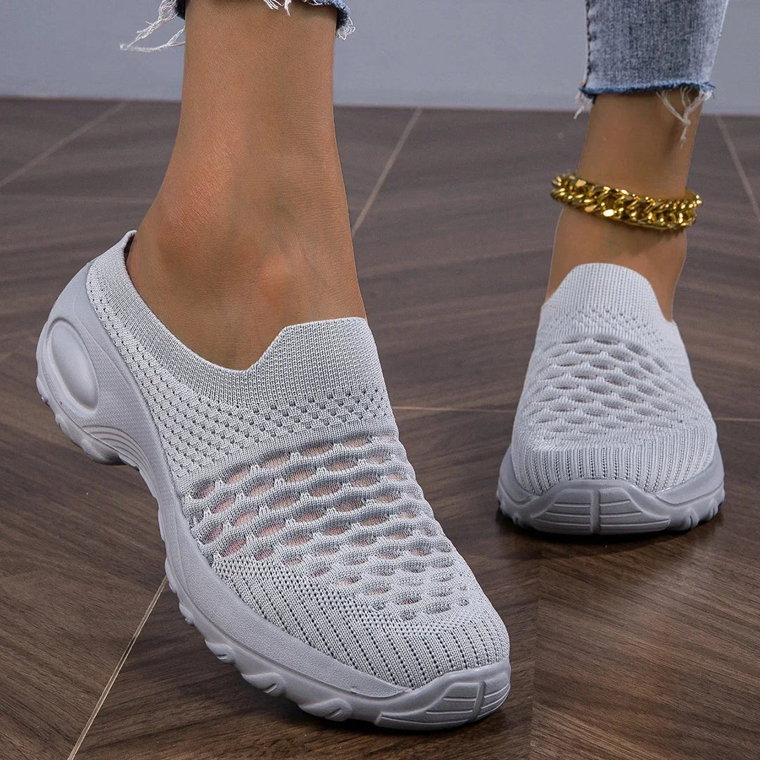 Women's airy slip-on walking sneakers with cushioned heel for comfortable everyday wear.