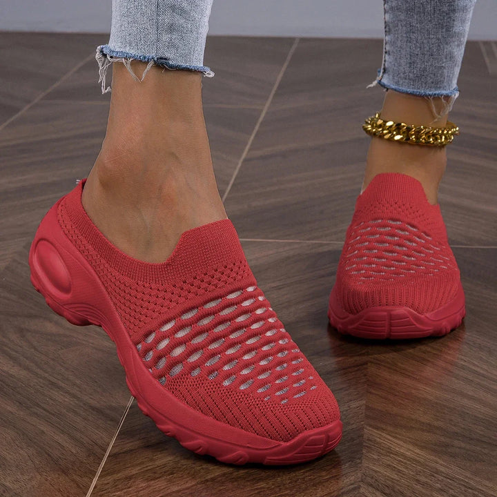 White women's airy slip-on walking sneakers, perfect for comfortable activewear and casual strolls.