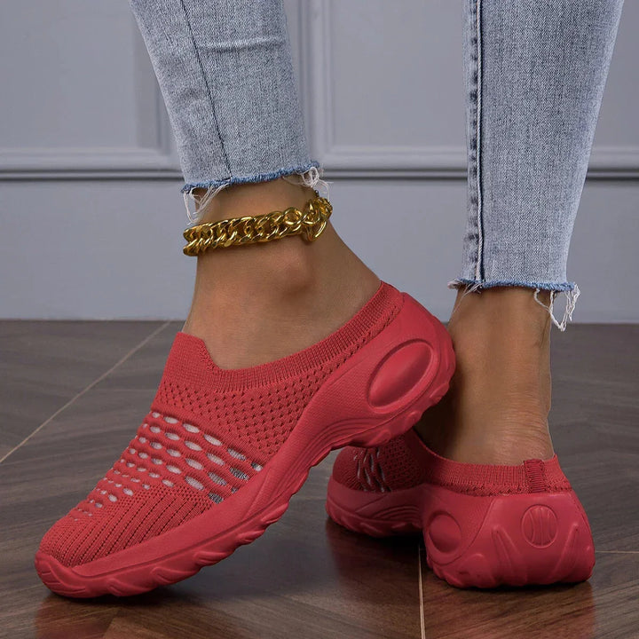 Black women's casual slip-on walking sneakers with a cushioned heel for ultimate comfort and support.