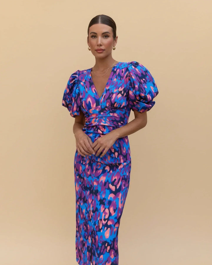 Women's animal print midi dress with puff sleeves & V-neck. Elegant wedding guest or party dress.