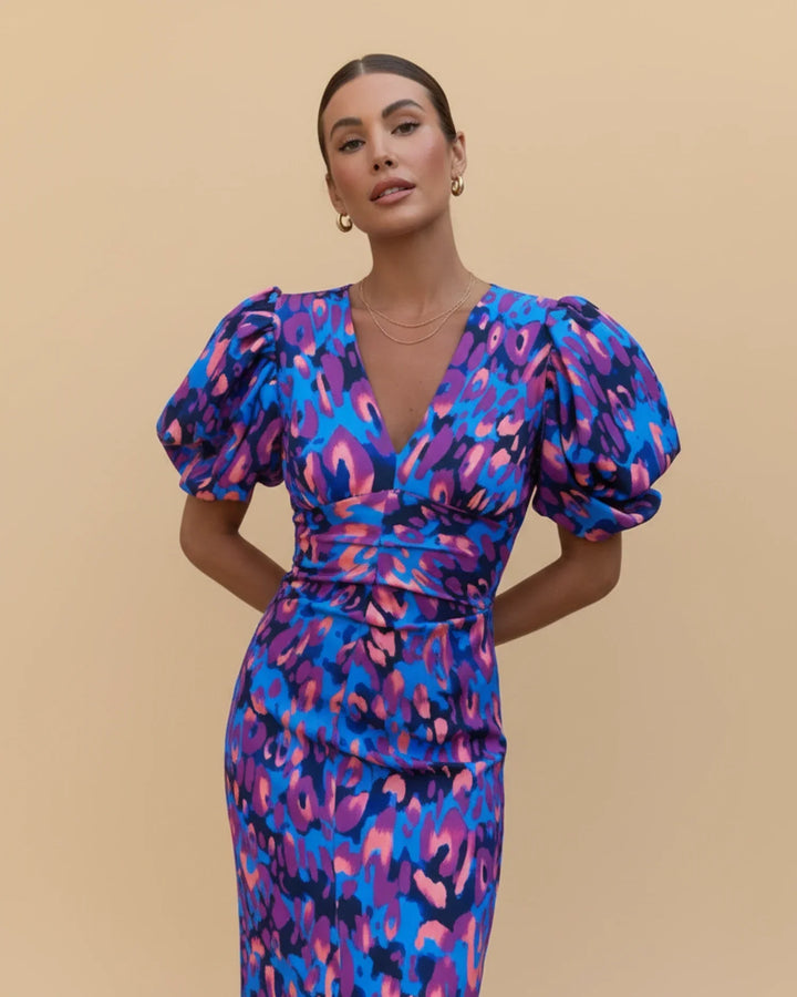 Stylish women's puff sleeve V-neck midi dress in a bold animal print, perfect for special occasions.