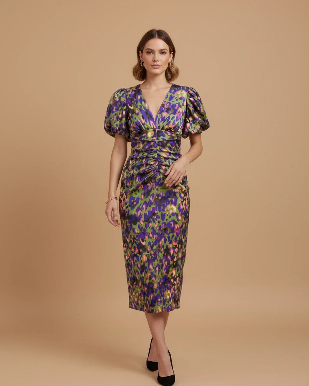 Fashionable women's midi party dress with animal print, elegant V-neckline, and stylish puff sleeves.
