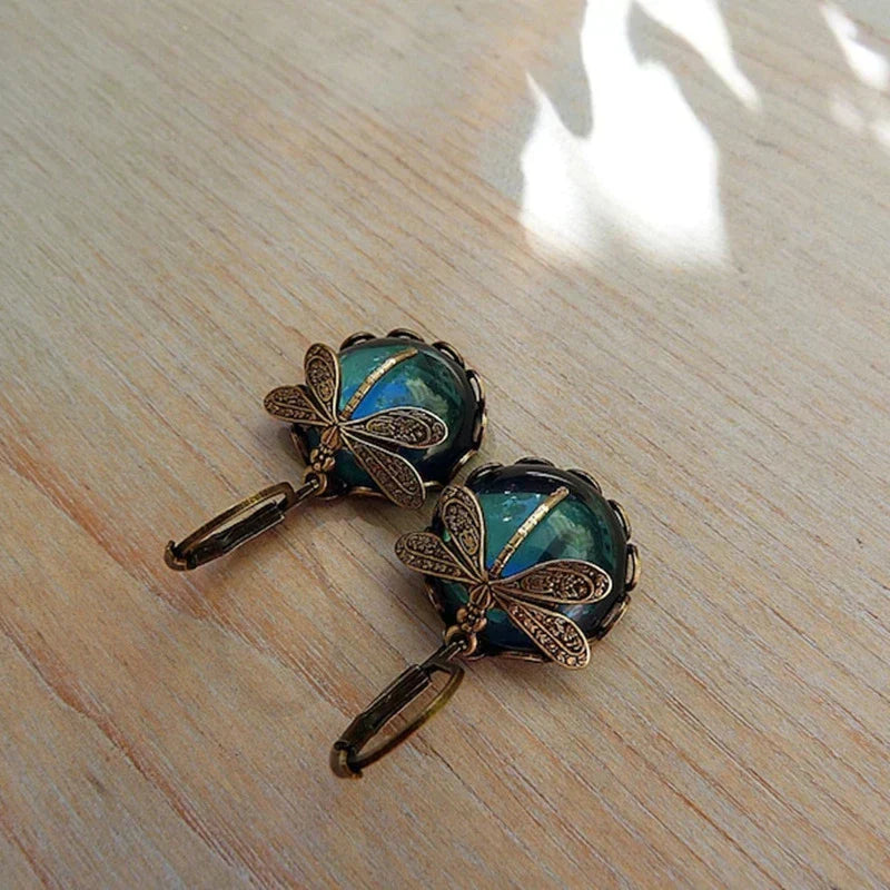 Sparkling crystal dragonfly dangle earrings for women. Unique antique-style jewelry with clear gems.