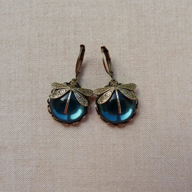 Beautiful dragonfly dangle earrings, adorned with shimmering crystals in an antique, elegant style for women.