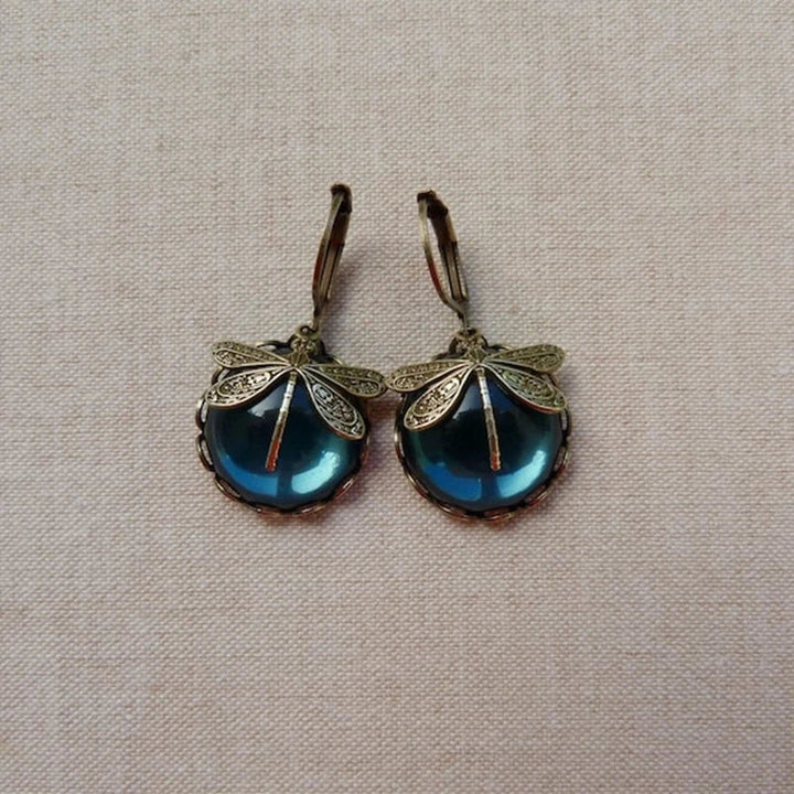 Beautiful dragonfly dangle earrings, adorned with shimmering crystals in an antique, elegant style for women.