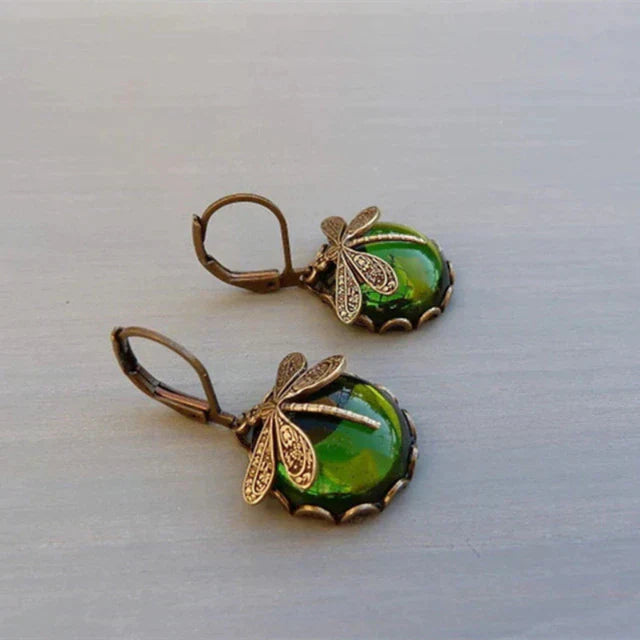 Delicate antique crystal dragonfly earrings, elegant dangle jewelry for women, detailed and sparkling.