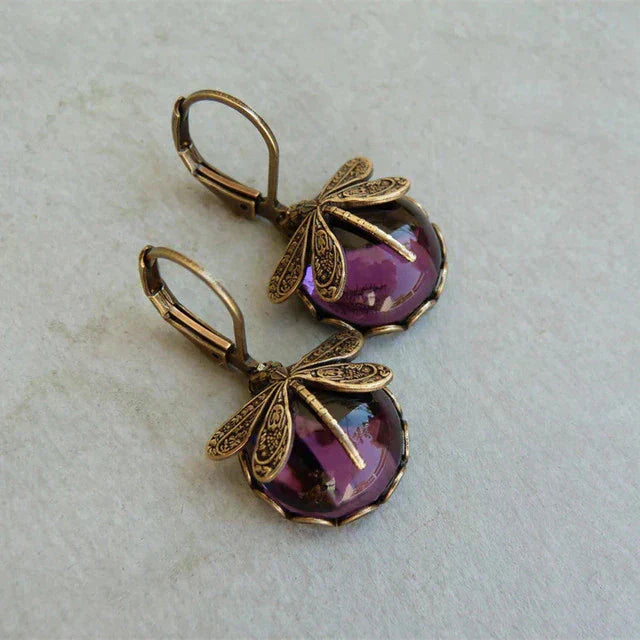 Women's elegant antique crystal dragonfly earrings, perfect for adding unique sparkle to any outfit.