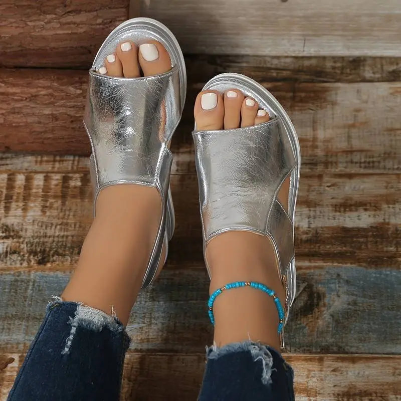 Close-up of Aria women's orthopedic platform sandals, showing metallic straps & comfortable arch support for all-day wear.