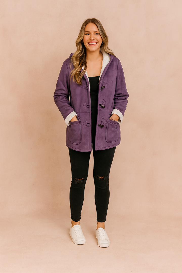 Close-up of the Arlena women's winter coat, highlighting the plush hood and durable fabric.