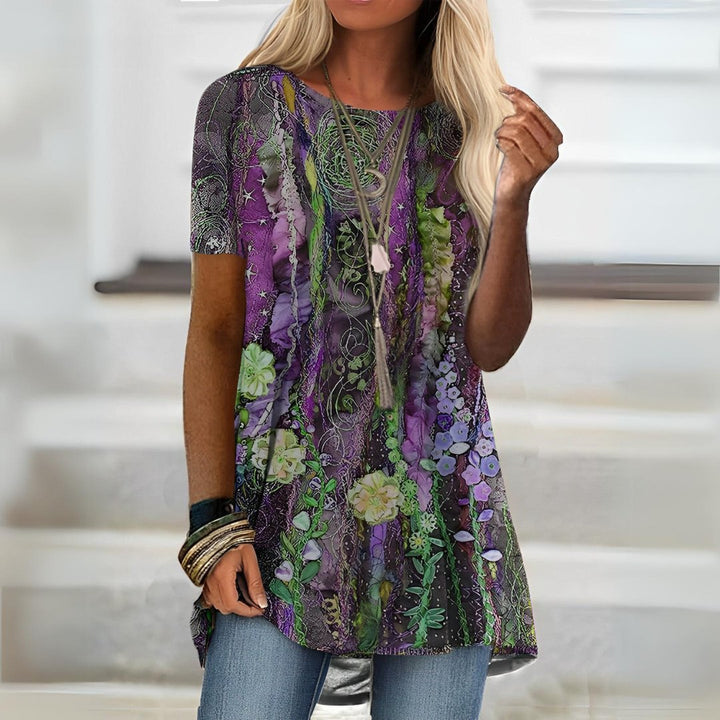 Vibrant ladies' artistic print short sleeve summer top. Relaxed fit, perfect for stylish casual and everyday wear.
