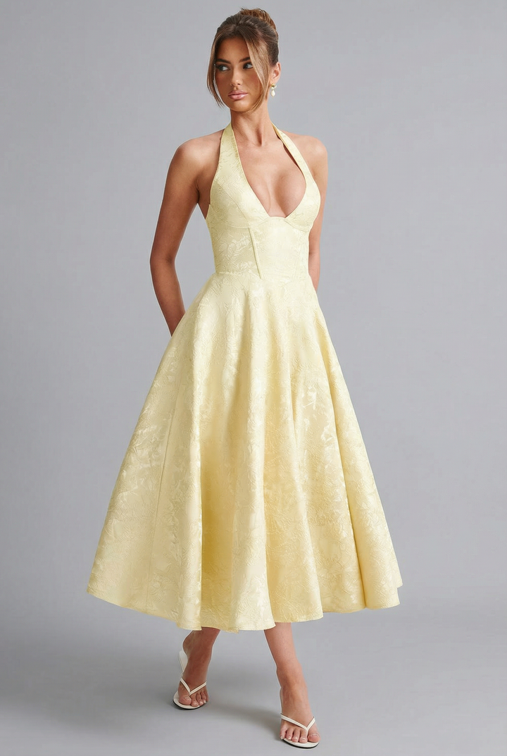 Sophisticated occasion dress for women, featuring a corset and ascot bow tie.