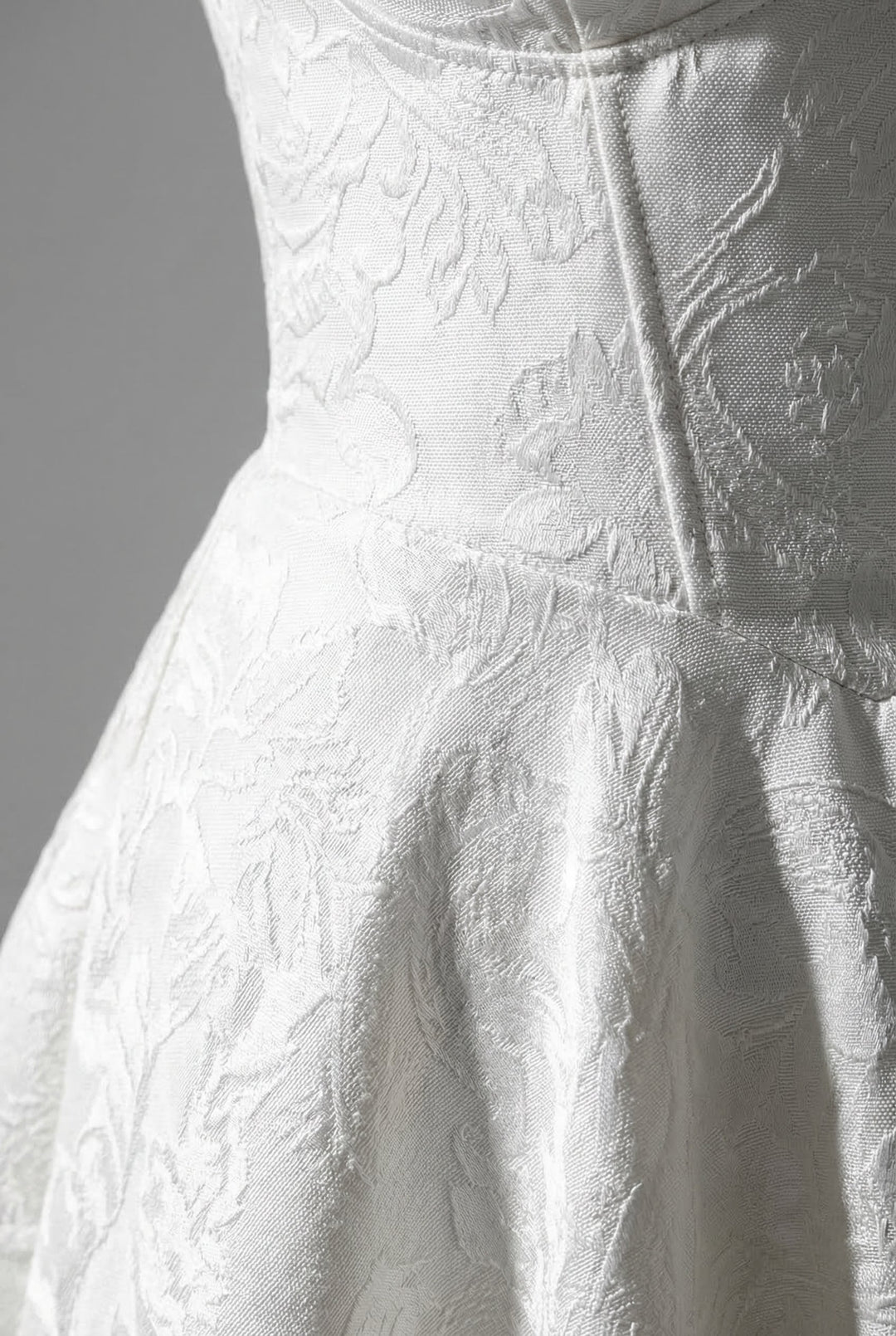 Floral print occasion dress with a sophisticated halterneck and corset design.