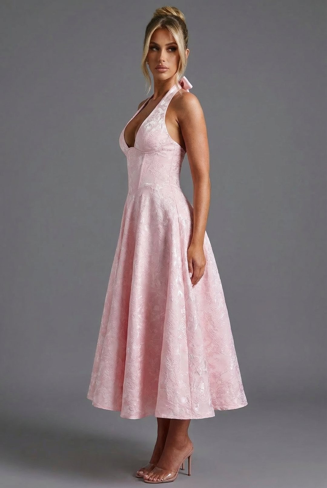 Fashionable women's dress showcasing a corset waist and elegant ascot bow tie.