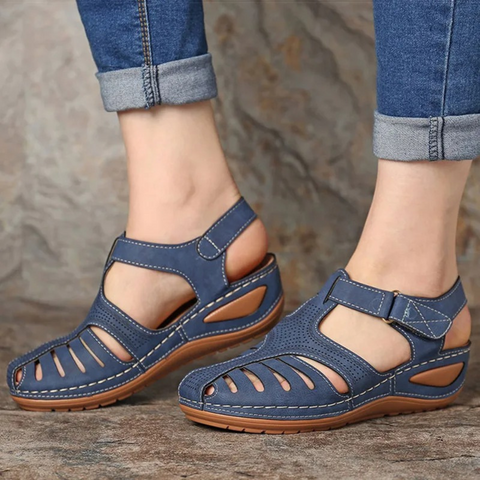 Woman wearing comfortable Astrid walking sandals for daily activities.