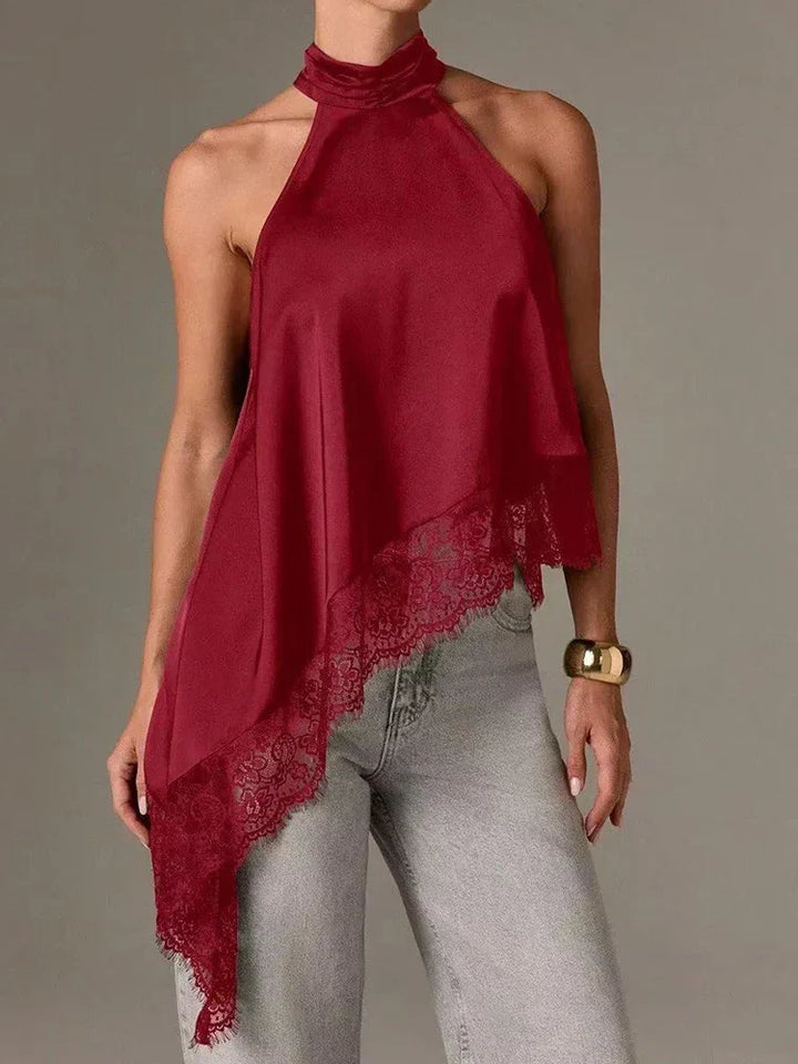 Stylish women's asymmetric halter blouse with intricate lace trim, a versatile top for smart casual or elegant wear.
