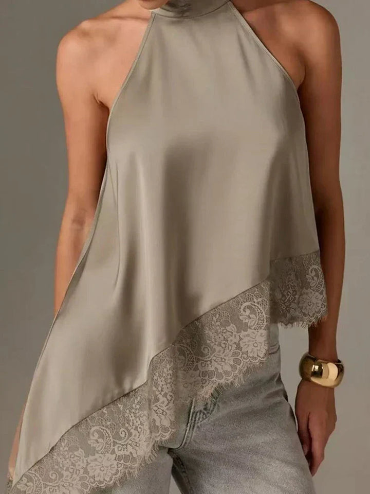 Modern women's asymmetric halter top in a smart casual style, featuring elegant lace trim and a comfortable fit.