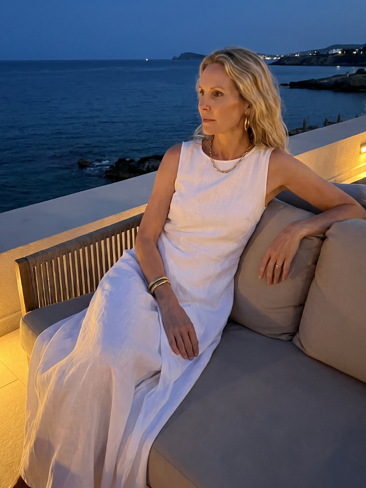 Elegant women's asymmetric maxi dress, layered design with a classic round neck for sophisticated style.