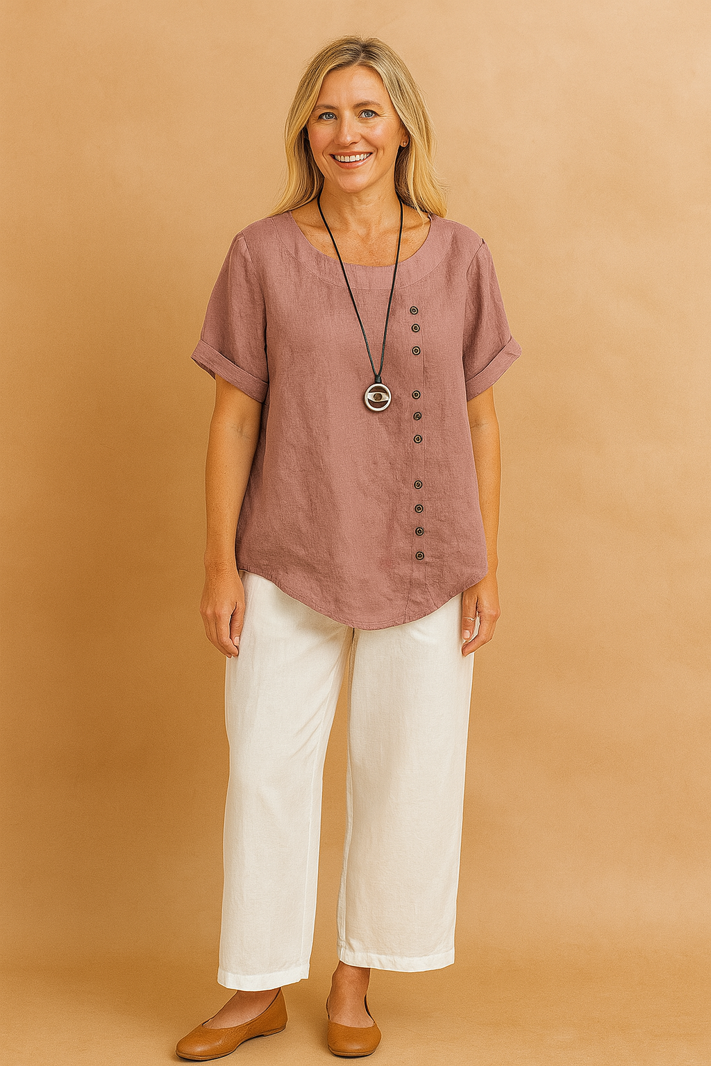 Women's asymmetrical blouse with a decorative clasp. Stylish short-sleeve top for casual or elegant wear.
