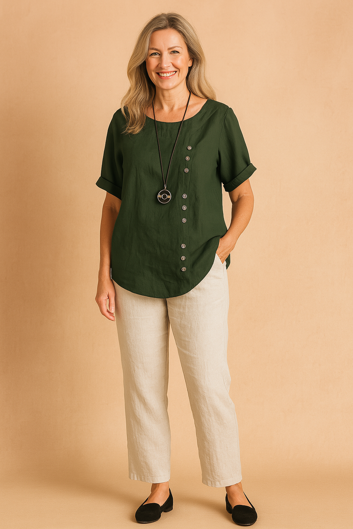 Fashionable women's spring blouse. Asymmetrical design with a decorative clasp, offering comfort and style.