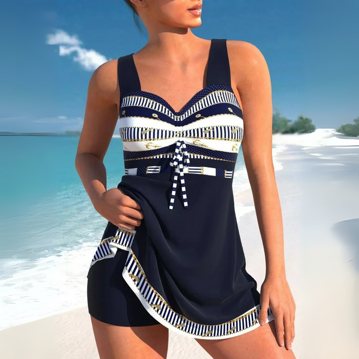 Stylish women's ruched tankini swimdress featuring a vibrant Aztec pattern, perfect for summer