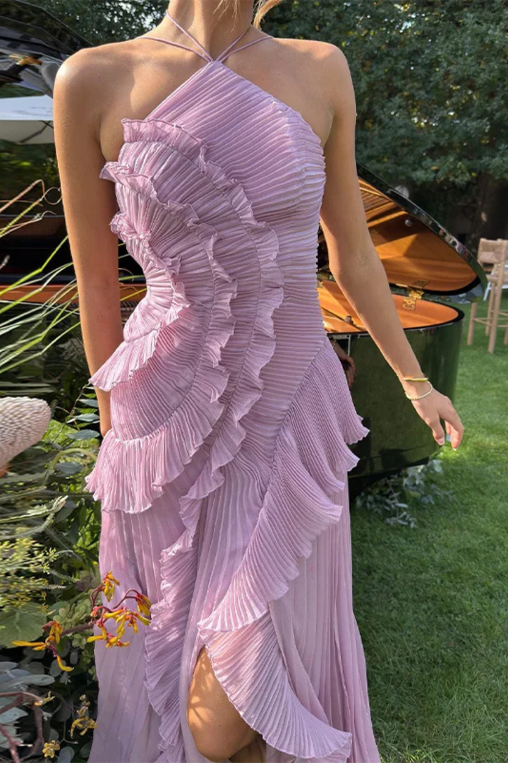 Stunning backless design of a women's halter maxi dress, perfect formal wedding guest gown.