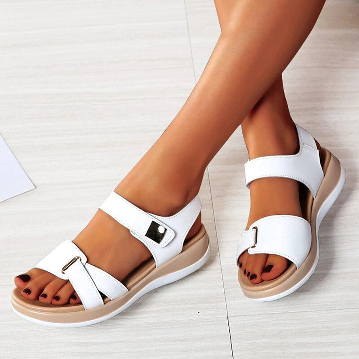 Women's beige adjustable orthopedic sandals with cushioned footbed for ultimate comfort & foot support. Ideal summer walking shoes.