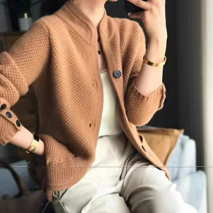 Grey women's textured knit button-up jacket, collarless and relaxed fit, a versatile layering piece for casual outfits.
