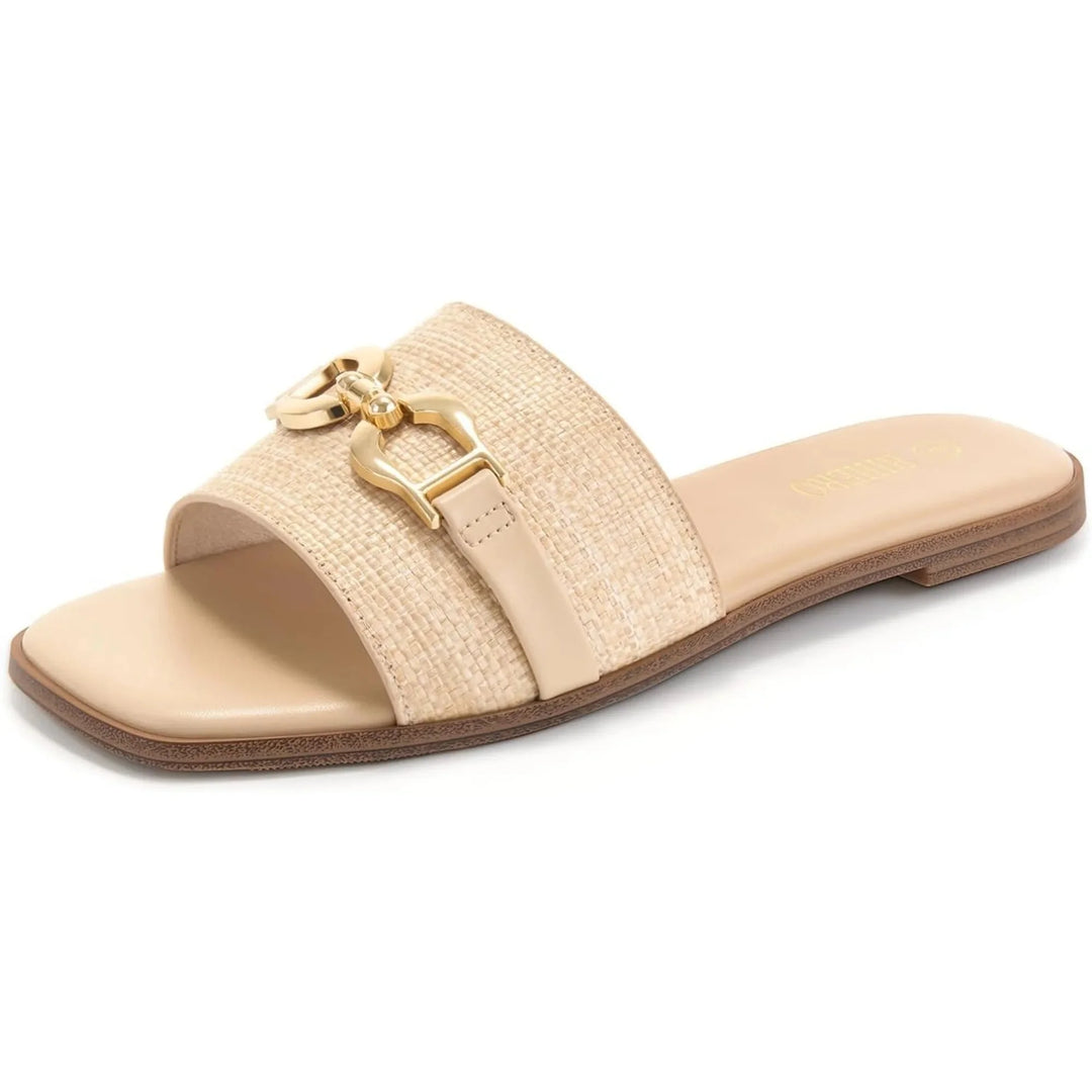 Women's beige woven slide sandals with decorative buckle accent. Ideal for summer casual wear.