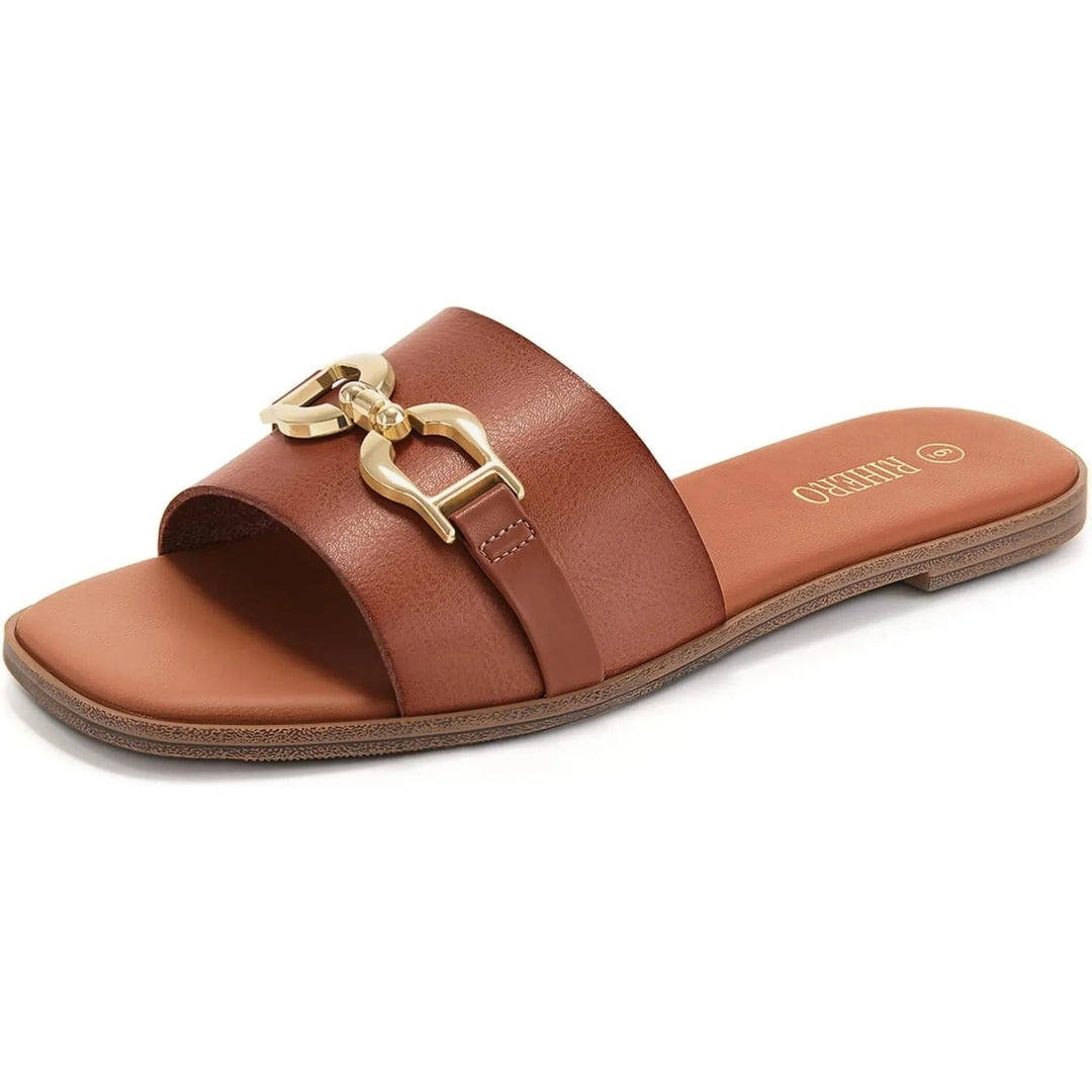 Close-up of women's comfortable beige woven slide sandals, showcasing the decorative buckle detail.