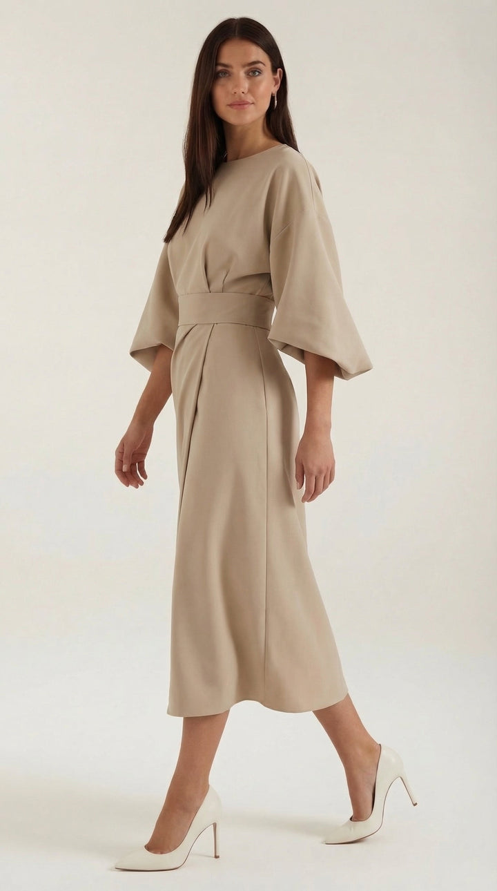 Wrap style midi dress featuring a flattering belt