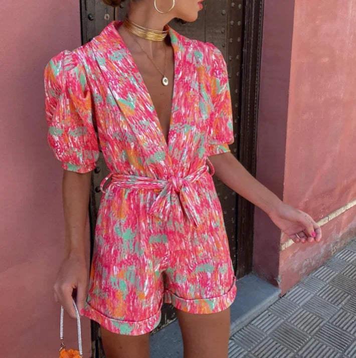 Stylish women's romper with flattering belt & elegant puff sleeves. Perfect for any wedding or special event.