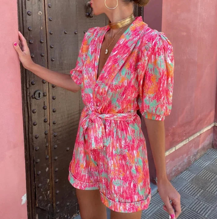 Dressy women's belted puff sleeve romper. A sophisticated jumpsuit alternative for formal daytime events.