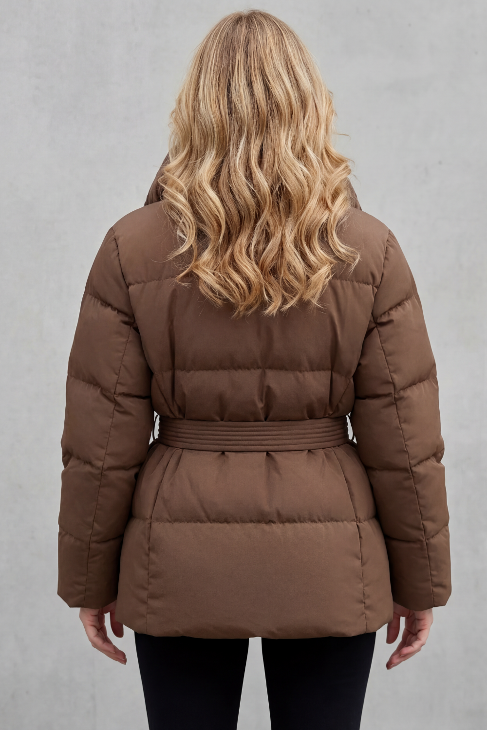 Chic women's belted puffer coat in a fashionable design, offering ultimate warmth for cold winter days.