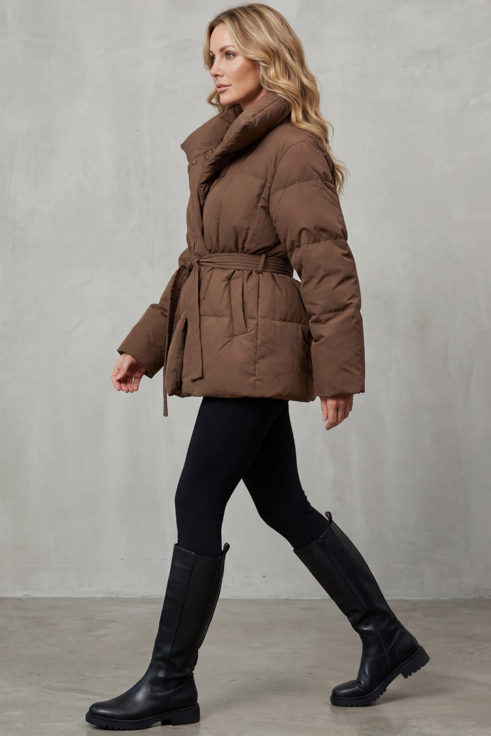 Cozy women's puffer coat, a stylish belted winter jacket providing essential warmth and comfort.