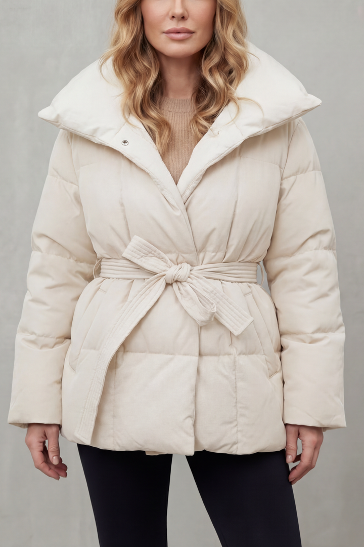 Elegant women's belted puffer coat. A warm winter jacket featuring a chic design & practical warmth.