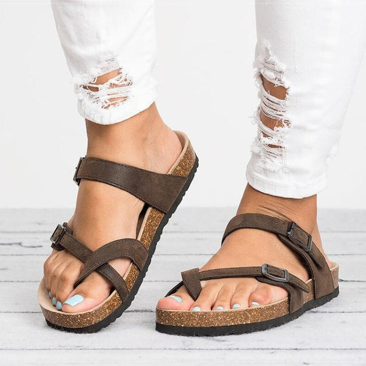 Women's black adjustable comfort sandals for all-day wear, featuring sturdy straps & foot support.