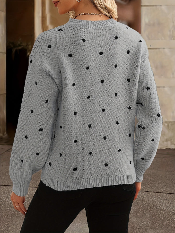 Detailed view of the texture on a warm women's polka dot crew neck sweater.