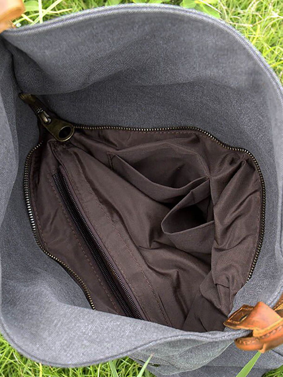 Stylish women's black asymmetrical slouchy bag, shown as a crossbody for hands-free convenience.