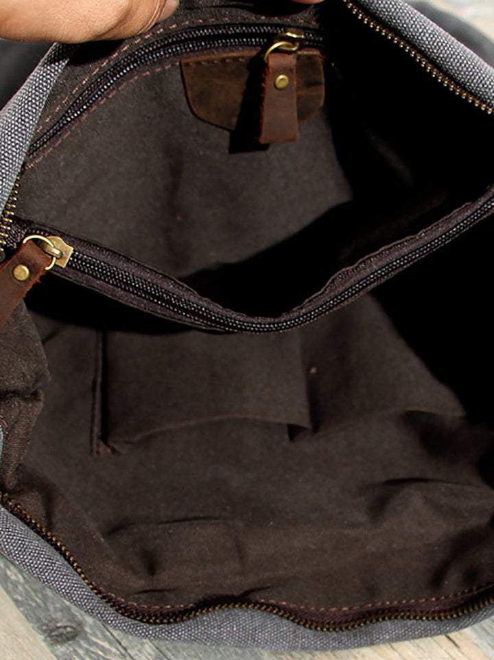 Women's brown asymmetrical slouchy crossbody bag, designed for comfort with an adjustable strap.