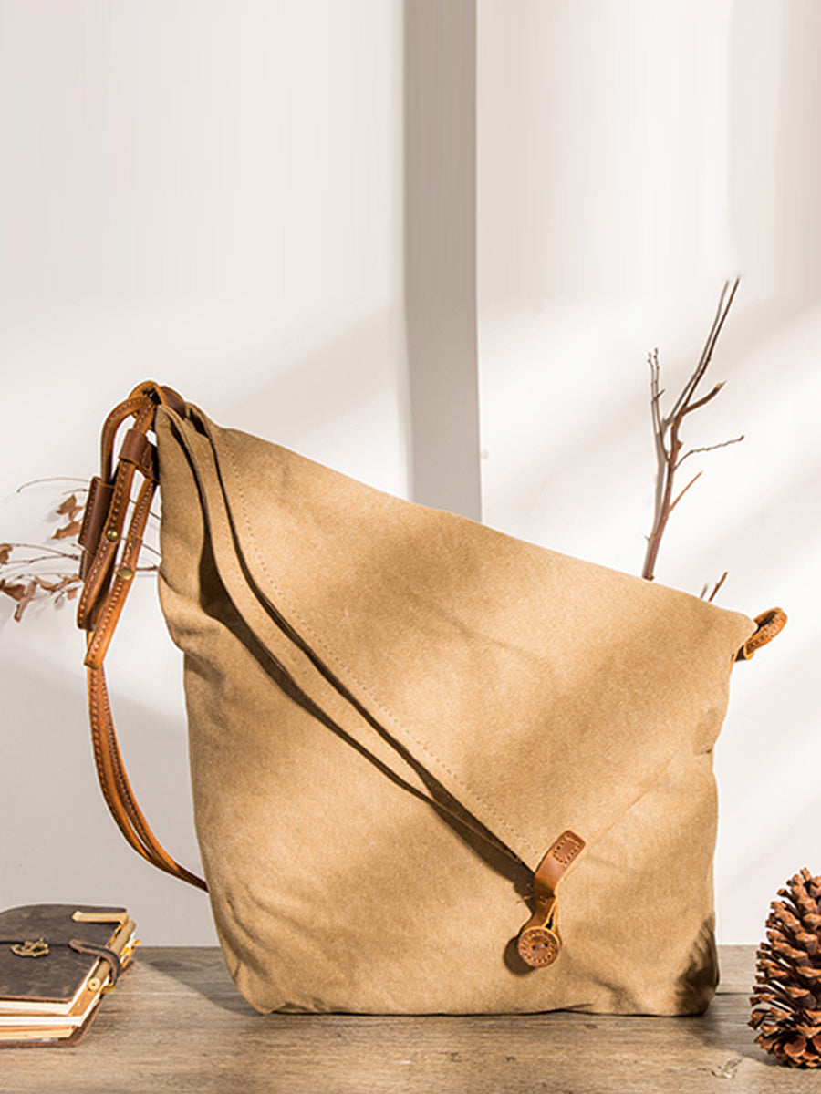 Everyday women's grey asymmetrical slouchy shoulder bag with an adjustable strap & button closure.
