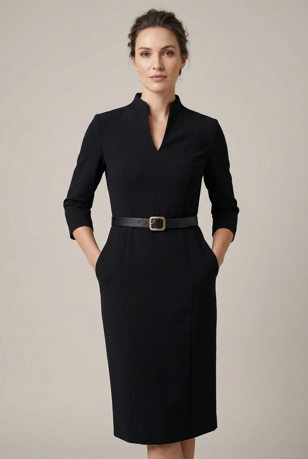 Women's black belted midi dress. Elegant, tailored fit for professional or evening wear. Chic and sophisticated.