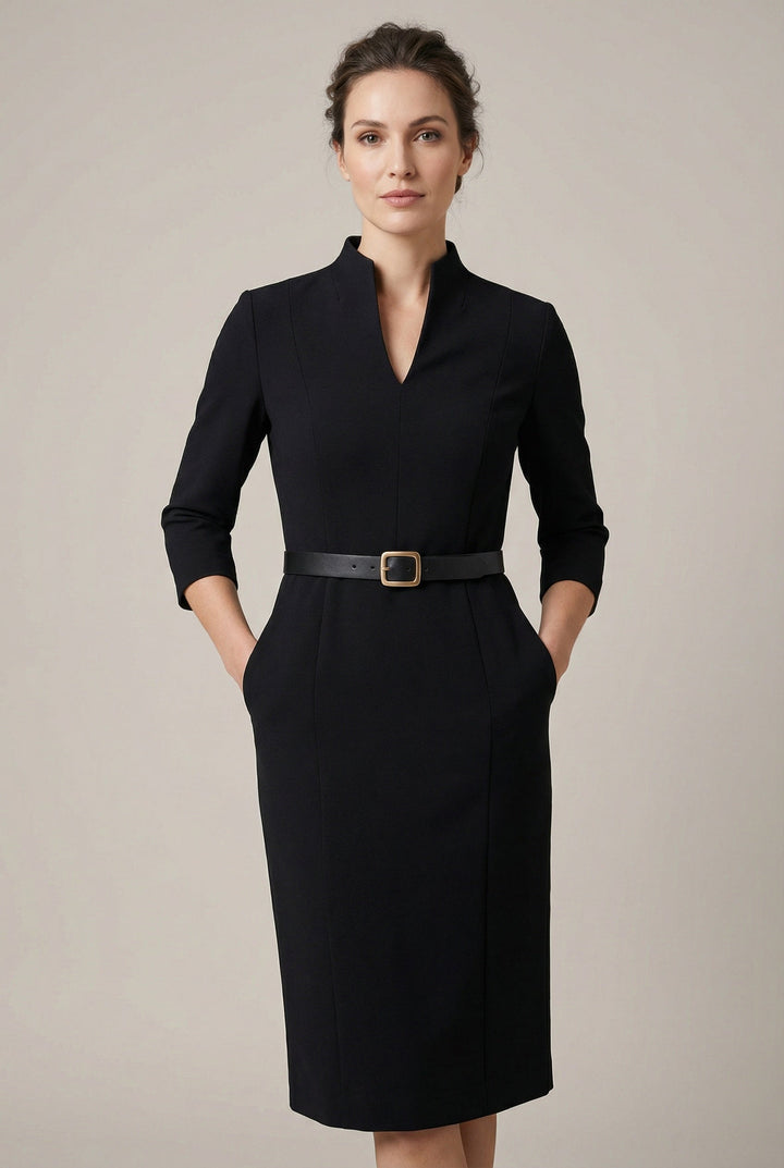 Women's black belted midi dress. Elegant, tailored fit for professional or evening wear. Chic and sophisticated.