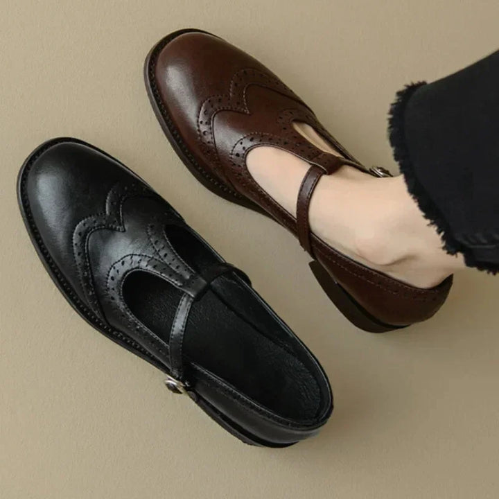 Comfortable women's brown T-Strap Mary Jane brogue shoes. Low block heel and elegant buckle, perfect for workwear.