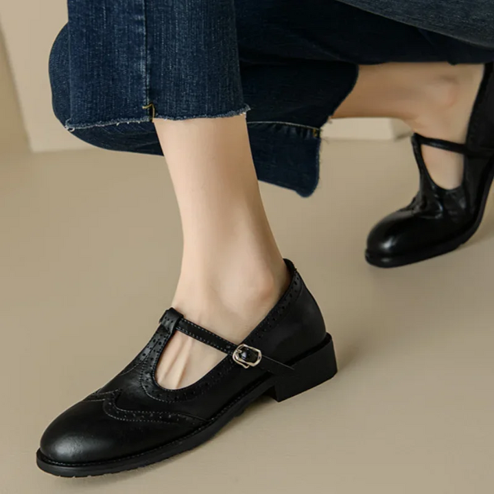 Elegant women's Mary Jane brogue shoes with T-strap and low block heel. Versatile classic style, ideal for work.