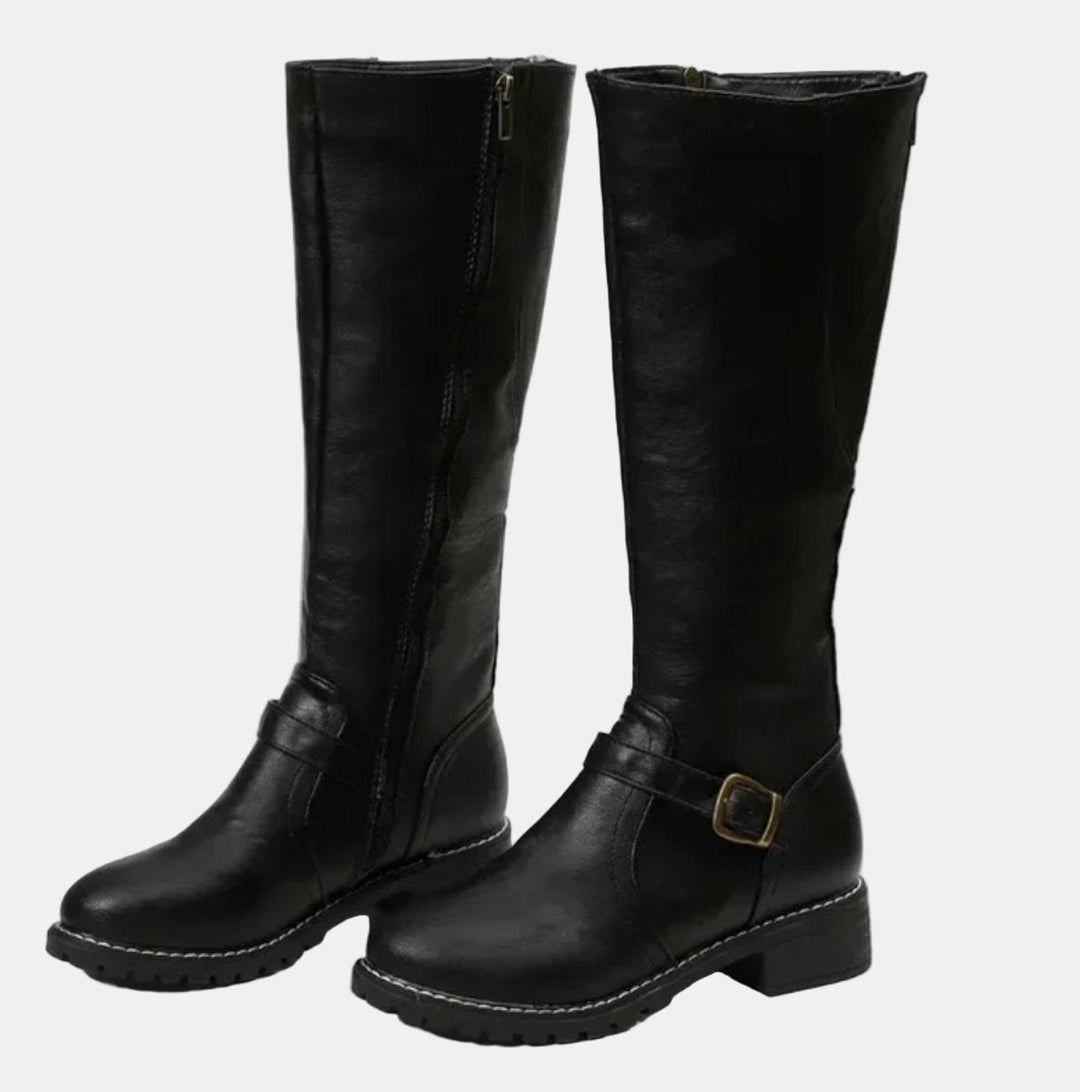 Comfortable women's low heel tall boots with decorative buckle straps, ideal for everyday autumn adventures.