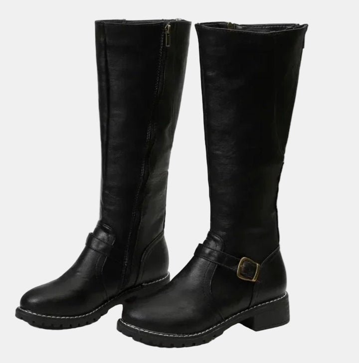 Comfortable women's low heel tall boots with decorative buckle straps, ideal for everyday autumn adventures.